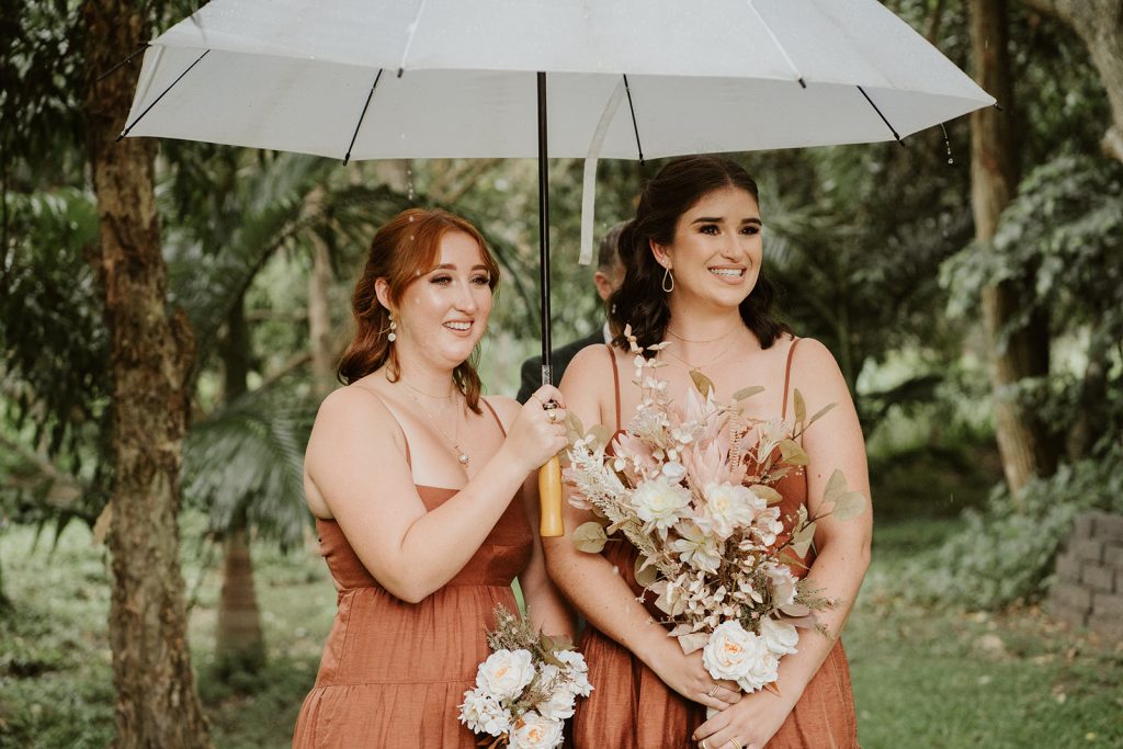 bridesmaids at rainy wedding