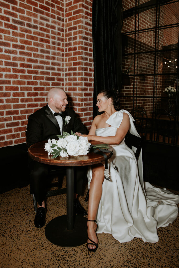 Black and white wedding colour palette with the bride wearing a white dress and black shoes