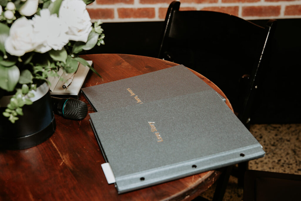 personalised wedding love story. Celebrants stylish ceremony folders with the words 'Love Story' and 'Sign here lovers' embossed in gold. 