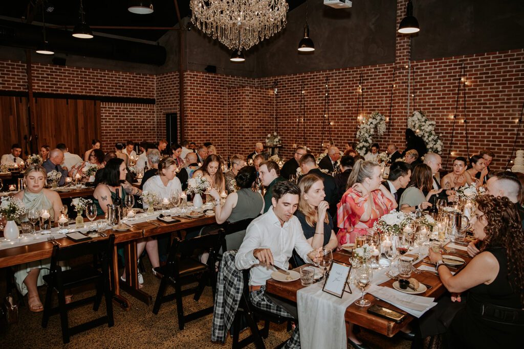 wedding reception at factory51 with guests seated at long tables