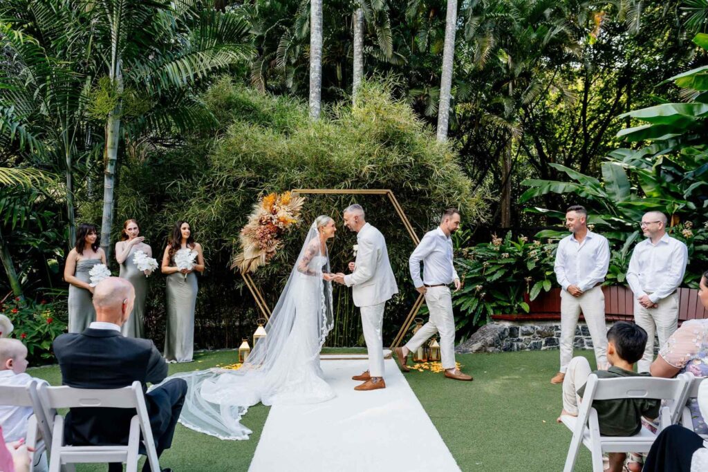 best man handing the wedding rings over