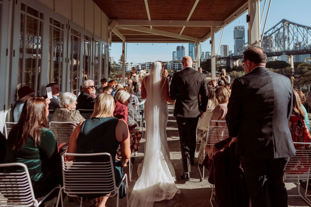 groom walks bride down the aisle